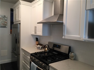 Kitchen in manhattan 
after white shaker cabinet with white cararra quartz